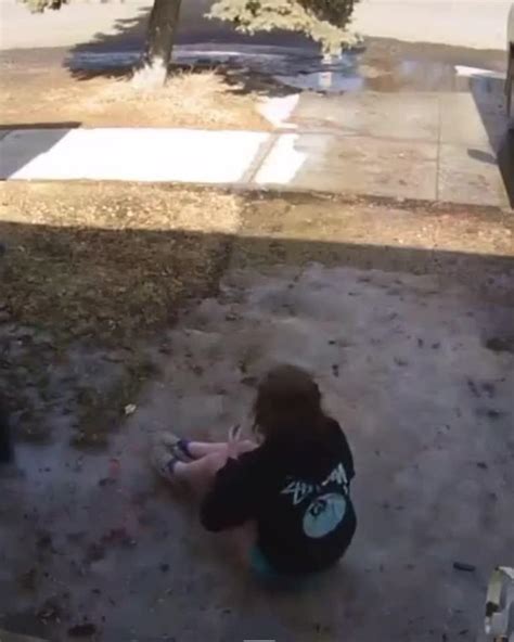 Woman Slips While Sitting And Posing On Rock And Falls In Water Jukin Media Inc