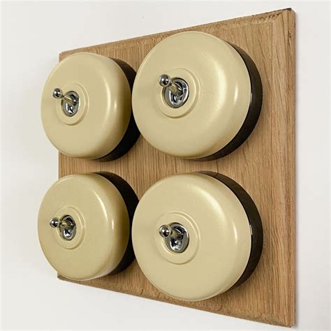 Round Dolly Light Switch 4 Gang Stone On Oak Pattress With Black Mounts