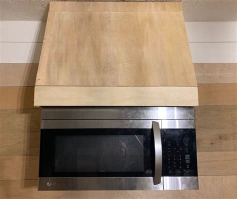 We paid to have the hood built, however, i have included interior photos of the hood, and how it was installed for those of you who might like to tackle building this hood on your own. DIY faux vent hood with microwave | Mounted microwave ...