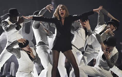 The Show Must Go On Taylor Swift Is Surprised When Impulsive Fan Grabs