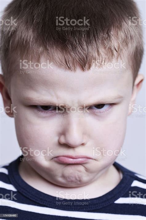 Close Up Portrait Of An Angry Boy Stock Photo Download Image Now