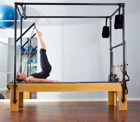 Premium Photo Pilates Woman In Reformer Tower Exercise At Gym
