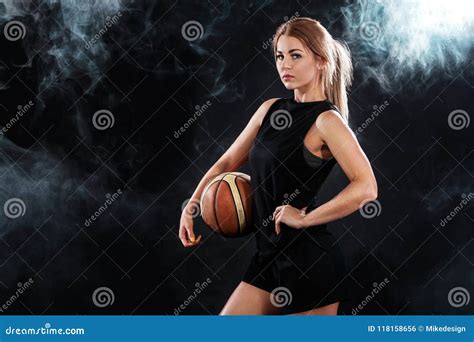 Portrait Of A Beautiful And Girl With A Basketball In Studio Sport