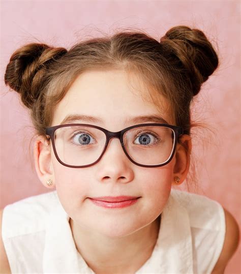 Portrait Of Funny Smiling Little Girl Child Wearing Glasses Isolated On