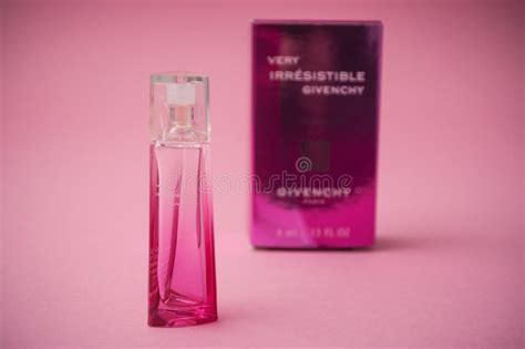 Givenchy Irresistible Perfume In Pink Bottle On Satin Background