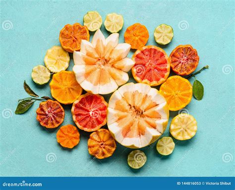 Various Citrus Fruits On Light Blue Background Top View Composing