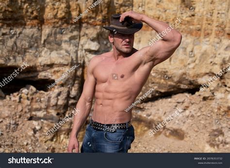 Стоковая фотография 2078353732 Man Muscular Body Posing Outdoors