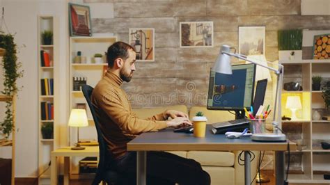 Side View Of Game Developer Working From Home Office Stock Image