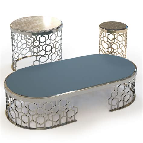 Three Metal Tables With Circular Tops And Geometric Designs On The Top
