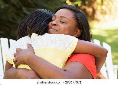 African American Mother Hugging Her Daughter Stock Photo Edit Now