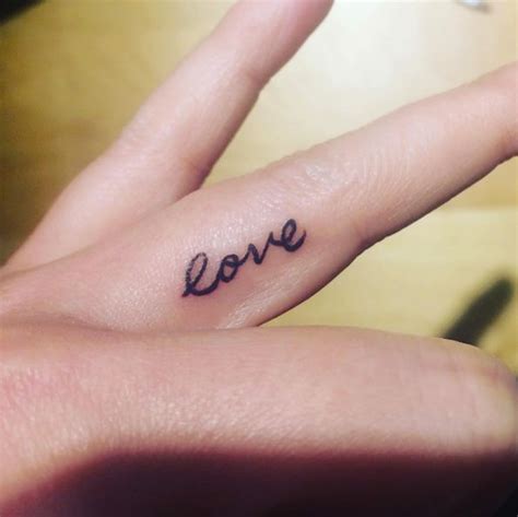 Women everywhere are ditching their finger bling and trading it in for finger tattoos that range from intricate bohemian designs to simple lines and arrows. 'Love' finger tattoo via Erika | Small finger tattoos ...