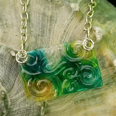 It looks like a petrified forest of color! Resin and alcohol ink handcrafted by me! See my FB page ...