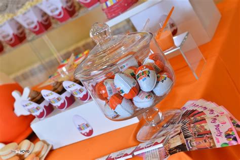 An Orange Table Topped With Lots Of Candy