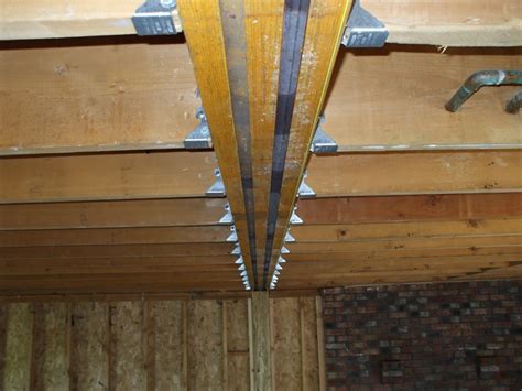 Covering the ceiling beams this way will completely hide them above the new ceiling. framing - Can you place a support header in the ceiling ...