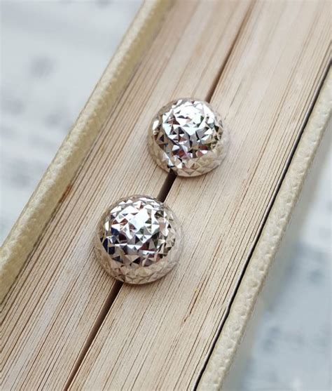 Maybe you would like to learn more about one of these? Fine 9ct White Gold Half Ball Stud Earrings | Chains of Gold