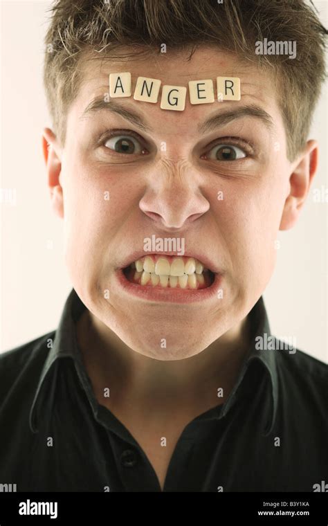 Man With The Word Anger Spelled On Forehead Stock Photo Alamy
