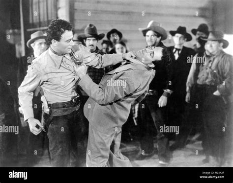 SANTA FE STAMPEDE, from left: John Wayne, LeRoy Mason, 1938 Stock Photo