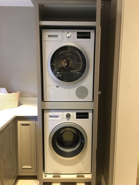 Pin by Person on Vic kitchen | Stacked washer dryer, Utility room ...
