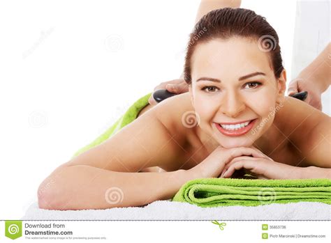Beautiful Woman Lying on Spa Salon Having Stone Massage. Stock Photo ...