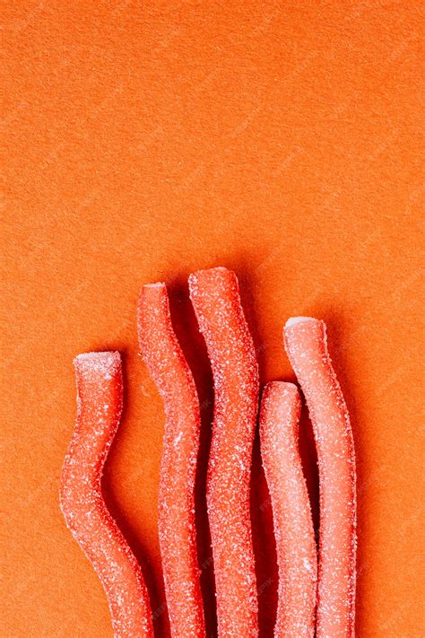 Premium Photo Red Chewy Candies Coated With Sugar