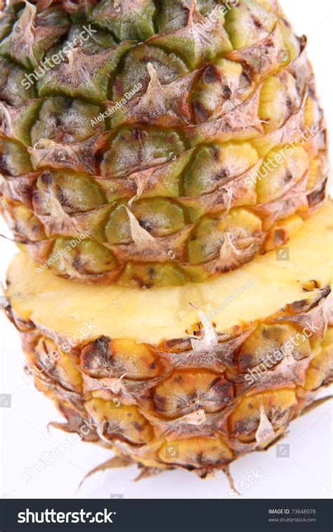Pineapple Cut In Half In Close Up On White Background Stock Photo