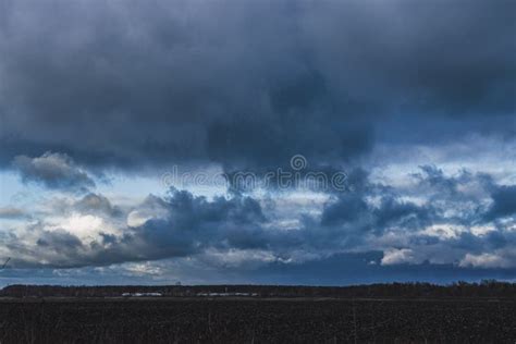 Background Of Dark Clouds Before A Thunder Storm Over Late Autumn