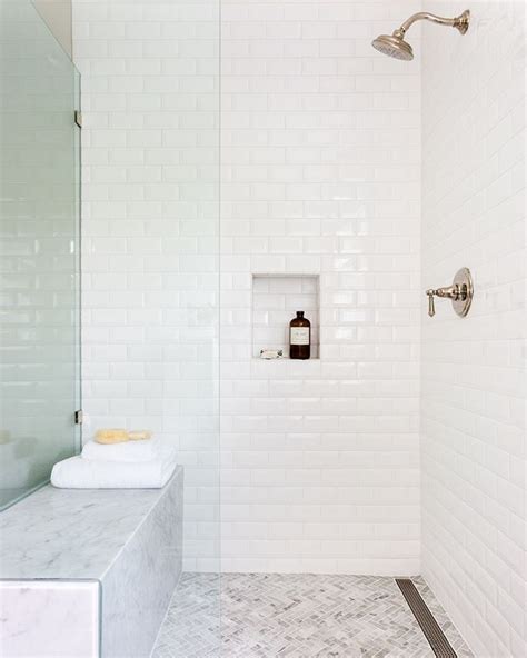 White Beveled Subway Tile Marble Wrapped Bench And Herringbone Floor Mosaic Transform This