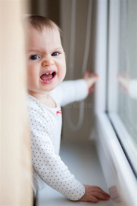 Little Baby Girl Screaming Near The Window Stock Photo Image Of Mouth