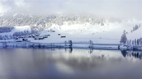 Beautiful Winter Lake With A Reflection Of The Swiss Mountains In