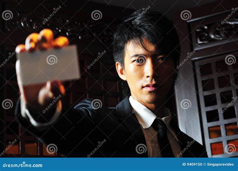 Asian Man Holds Business Card Stock Photo Image Of Empty Suit 9409150