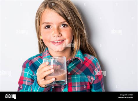 Happy Smiling Child Drinking Chocolate Milk Isolated On White Stock