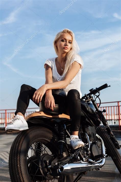 Biker Girl Sitting On Vintage Custom Motorcycle — Stock Photo © Johan