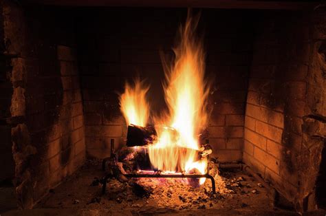Hot Roaring Fire In A Large Rustic Stone Fireplace Photograph By
