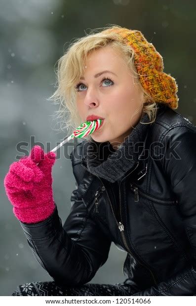 Pretty Woman Eating Lollipop Stock Photo Edit Now
