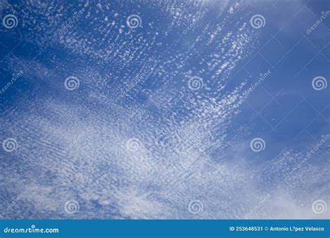 Bright And Intense Blue Sky With White Altocumulus Clouds Stock Image