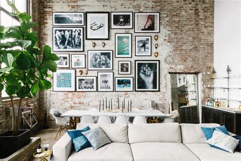 The photos and paintings used in this are also in keeping with the color scheme, and help to improve the look of the wall altogether. How to Create the Perfect Gallery Wall Layout - Decorilla