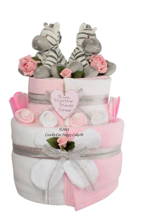 It's true that babies don't need gifts. Two Tier Twin Baby Girl Nappy Cake | Coochy Coo Nappy Cakes