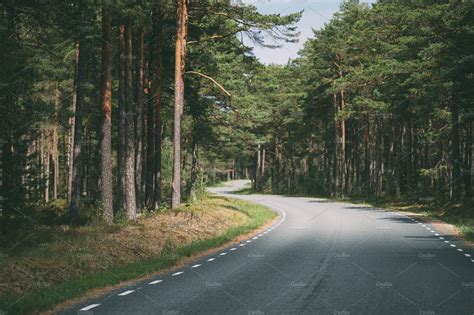 Winding Road Through Forest High Quality Transportation Stock Photos