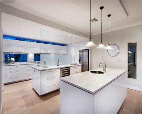 The island performs multiple tasks that keep this space uncluttered, as it is home to the sink, stovetop and serves as a serving piece showcase that perfectly matches the cabinets and brings the whole room together. Modern Design 2 Pac Paint Finish High Glossy White Kitchen ...