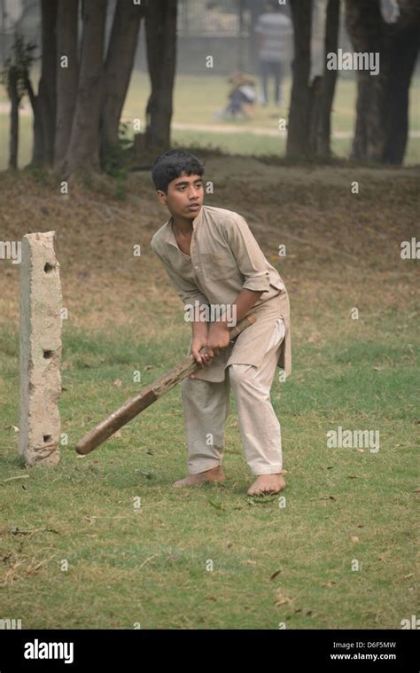 Indian Boys Playing Cricket In A Park In Delhi India Stock Photo Alamy