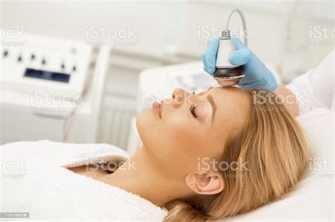 Beautiful Woman Receiving Facial Treatment Stock Photo Download Image
