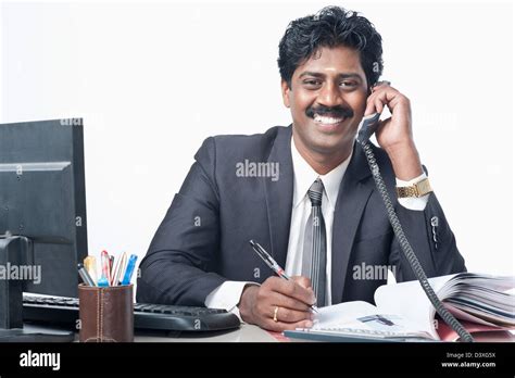 South Indian Businessman Working In An Office Stock Photo Alamy