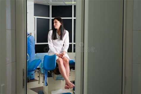 Woman At Gynecologist Office Sitting And Waiting For A Doctor With Test