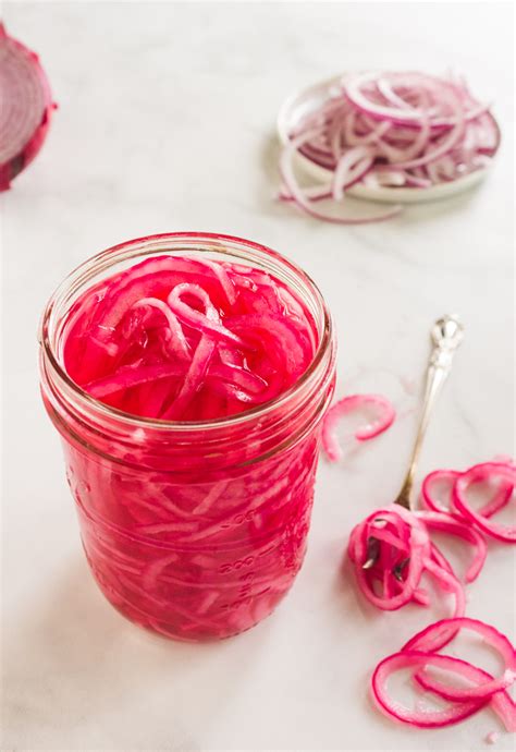 First you will want to thinly slice an onion. Quick Pickled Red Onions - Robust Recipes