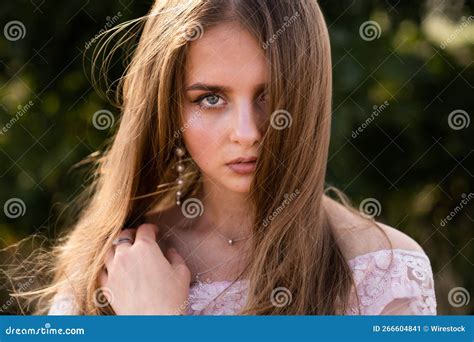 Caucasian Blonde Woman Wearing A Pink Dress Posing In A Wild Nature Stock Image Image Of