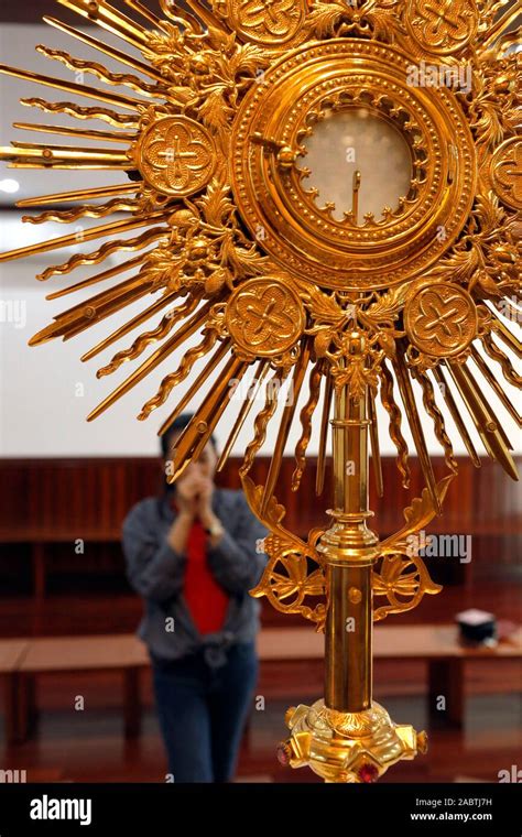 The Blessed Sacrament In A Monstrance Eucharist Adoration Woman