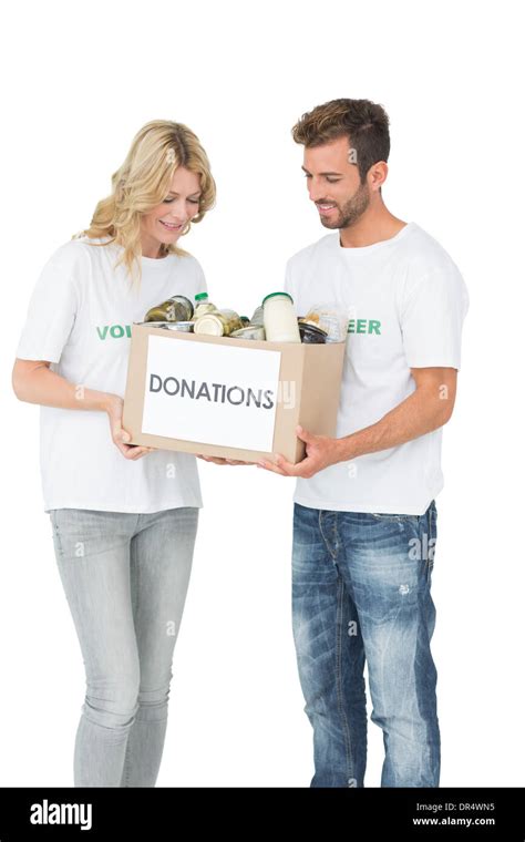 Smiling Young Couple Carrying Donation Box Stock Photo Alamy
