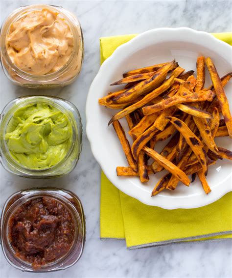 Slim cut roasted sweet potatoes with a healthy sauce for dipping! Baked Sweet Potato Fries + Vegan Dipping Sauces