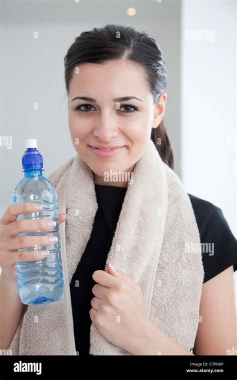 Woman Drinking Water After Workout Stock Photo Alamy