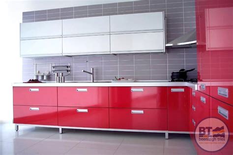 Love how this kitchen renovation creates an open feel for our clients to their dining room and office and a better transition to back yard! Vibrant red kitchen cabinets, grey tiles and silver bench ...